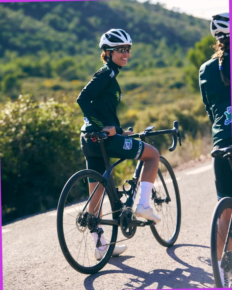 Cycling guide checking a paper map before a rural ride